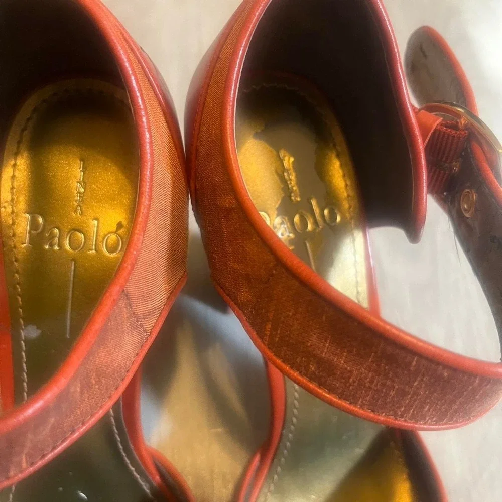 Paleo orange leather heels with gold buckle